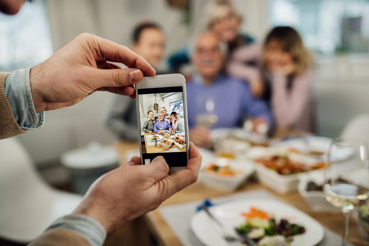 Guests using smartphones to upload photos and videos to a private event gallery