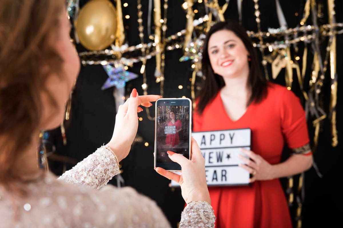 Guests capturing photos at a lively event with their smartphones