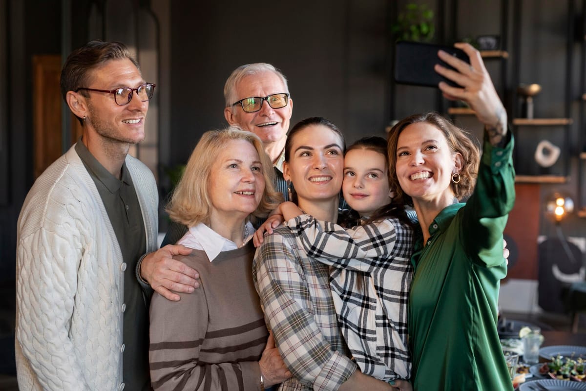 Three generations of family talking together at a home baby shower celebration