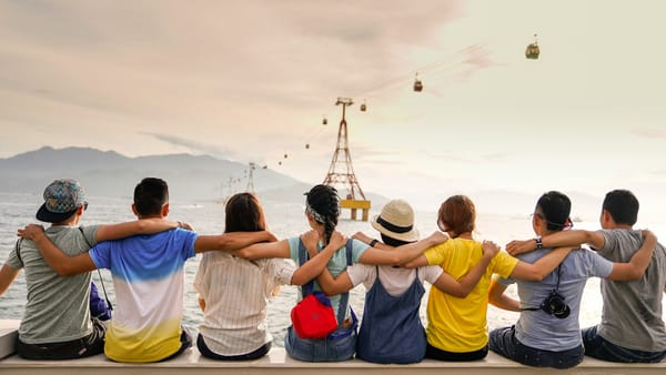 A group of people collecting photos using JoinMyMoment disposable camera app